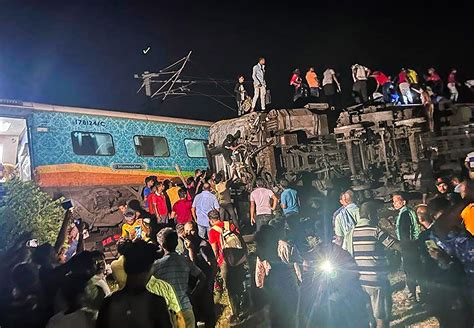 Passenger train derails in India, killing at least 13 and trapping many others